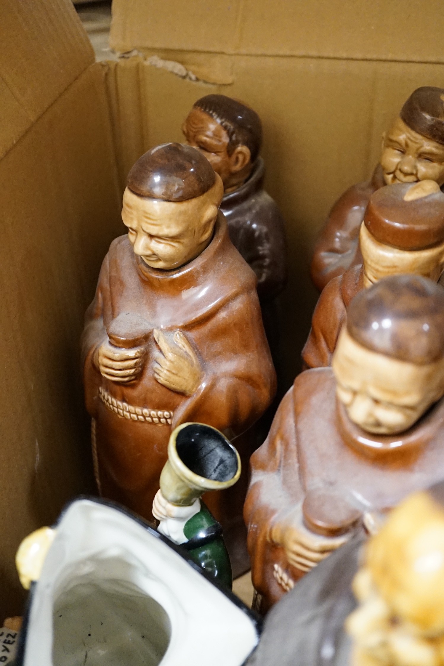 A group of twenty three Doulton ‘style’ figural spirit flasks and a jug